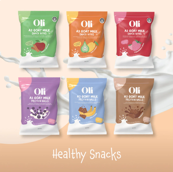 Six colorful packages of Oli A2 Goat Milk snacks and protein balls.